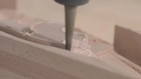Close-up of CNC machine cutting and shaping a wooden furniture part. Close-up of Video stock 342182003