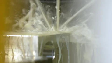 Close Up of CNC Machine Metalworking with Coolant Spray Stock Footage 296564477