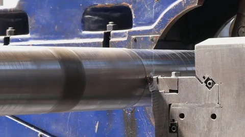 Close up of a CNC machine threading a steel roll. Twisted chips come flying o Stock-Footage 118977612