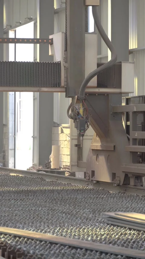 Close Up of CNC Plasma Cutting Head on Automated Steel Fabrication Machine Stock Footage 339384067