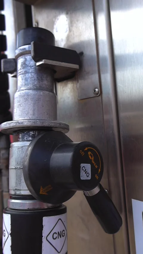 Close Up of a CNG Refueling Pump Nozzle with Start and Stop Buttons Stock Footage 336538671