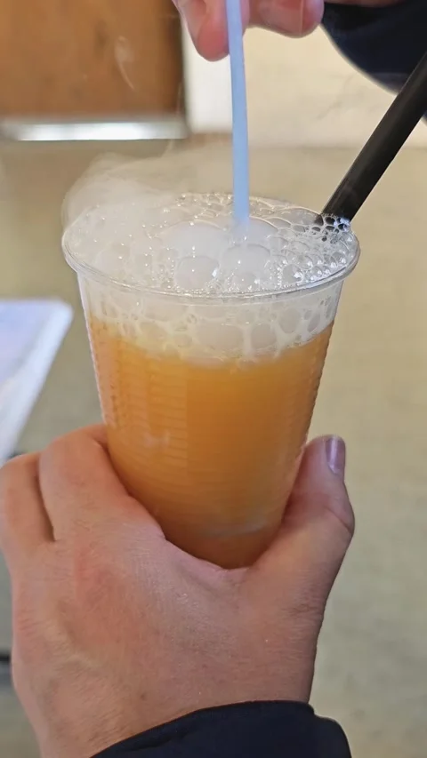 Close up of CO2 dry Ice in a mixed drink in vertical format Stock Footage 300719140