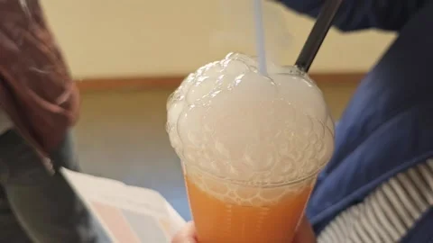 Close up of CO2 dry Ice in a mixed drink Stock Footage 300719246