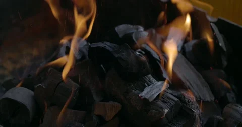 Close-up coal burn in the fire in slow motion. Stock Footage 189803330