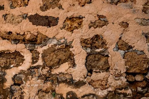 Close-up coarse shell rock masonry of stone wall, background and texture Foto stock
