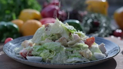 Close-up of coarsely chopped Caesar salad with chicken fillet in the ceramic Vídeos de archivo 204869824