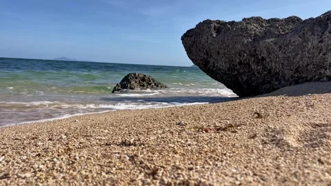 Close-Up Coastal Rock With Ocean Waves on Tropical Beach Stock Footage 334986193