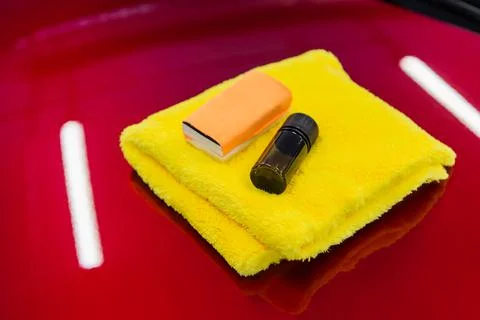 Close-up of a coating set: microfiber, sponge applicator and liquid glass nano Stock Photos