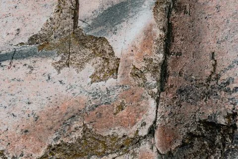 Close-up of cobblestone texture with pink, gray and greenish shades Stock Photos