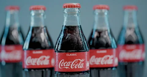Close up of Coca Cola soft drinks bottles in drops of water. Stock Footage 144271681