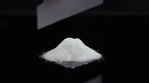 Close-up of cocaine getting cut into lines with a razor on a mirrored surface Video stock 119101660