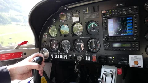 Close up cockpit avionics bay. Pilot piloting a small plane. Flying over Stock Footage 132751618