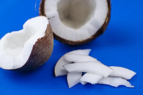 Close-up coconut, coconut shavings and coconut chips on a blue background. . Stock Photos