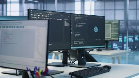 Close up of code on computer screens in server hub used for AI data processing 写真素材