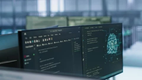 Close up of code on computers in high tech AI facility Stock Footage 319241716