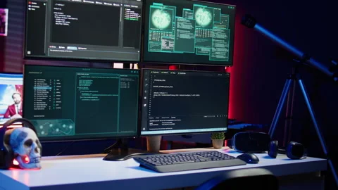 Close up of code running on computer displays in empty apartment used by hacker Stock Footage 275751741