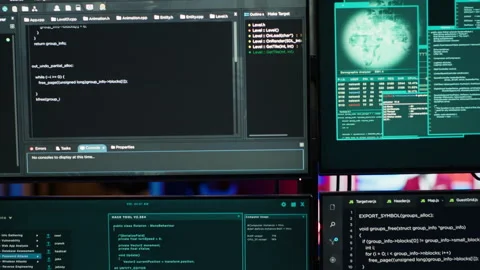 Close up of code running on computer displays in empty apartment used by hacker Stock Footage 275760371
