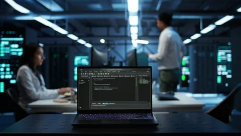 Close up of code running on laptop screen in data center Stock Footage 280723321