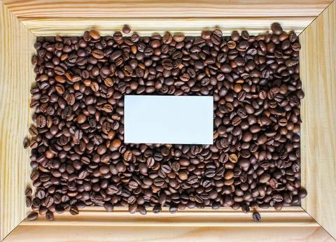 Close up coffee background. Heap roasted coffee beans spread over on table .. Foto stock