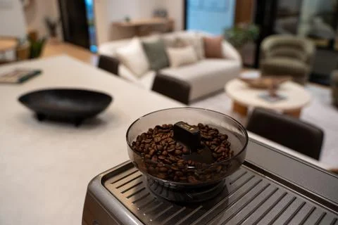 Close up of coffee beans in automatic espresso machine hopper Stock Photos