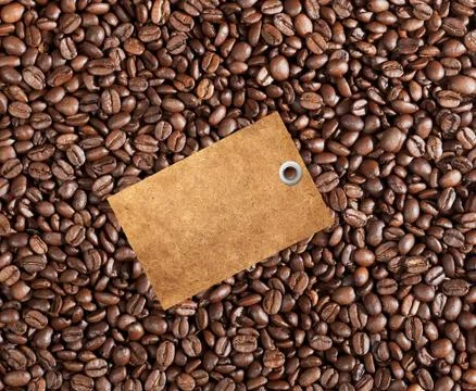 Close-up of coffee beans background and blank tag Stock Photos