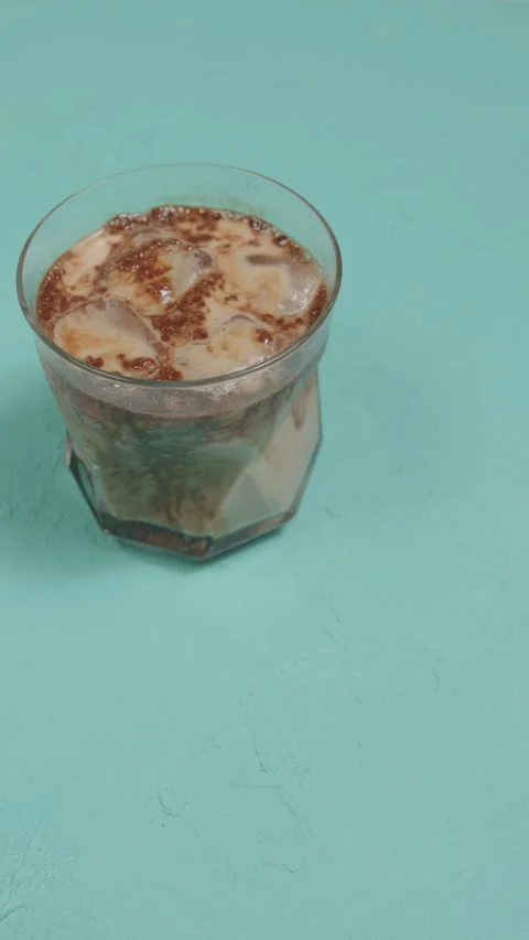 Close-up of coffee beans on blue backgroundcup of espresso coffee Stock Footage 292759535