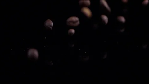 Close-up Coffee Beans falling down on table in slow motion Stock Footage 122056981