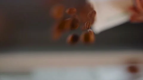 Close-Up of Coffee Beans Falling down From a Cup. Stock Footage 138951454