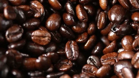 Close up of coffee beans falling in grinder machine Vídeo Stock 107306686