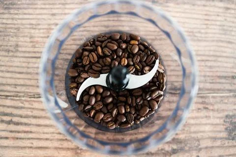 Close-up of coffee beans food processor about to get grinded, simple ingredie Stock Photos