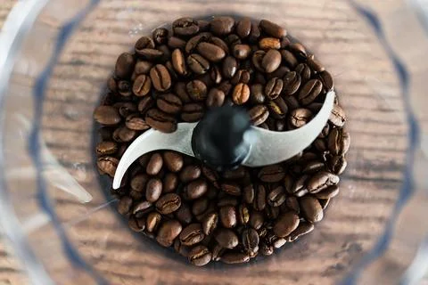 Close-up of coffee beans food processor about to get grinded, simple ingredie Stock Photos