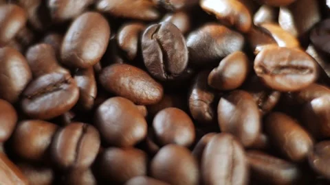 Close up of coffee beans with a lot of them in the foreground Stock Footage 298524975