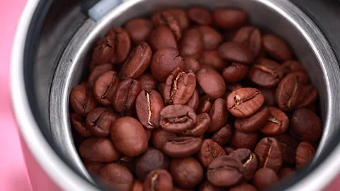 Close-Up Of Coffee Beans In A Metal Grinder Video stock 294552649