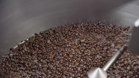 Close up of coffee Beans mixing in roaster closeup and slow motion, 4k Stock-Footage 112295080