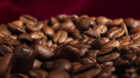 Close up of coffee beans with pink red velvet background Stock Footage 247411288