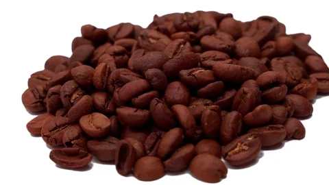 Close-up coffee beans rotate on a white background Stock Footage 128206782