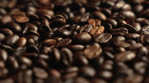 Close-up of coffee beans rotating. Coffee. Invigorating drink. Texture of coffee Stock Footage 305004311