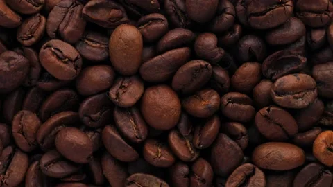 Close up of coffee beans, rotation in circle. Turning coffee. Stock Footage 234119563