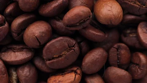 Close up of coffee beans, rotation in circle. Turning coffee. Stock Footage 234119618