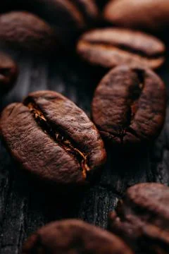 Close-up of coffee beans. Selective focus. Macro photo of coffee on dark Stock Photos