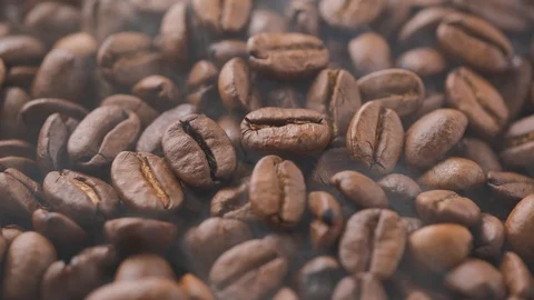 Close-up coffee beans with smoke are roasted and rotated 스톡 동영상 129251786