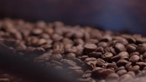 Close-up of coffee beans stirring in the machine Stock Footage 199473169