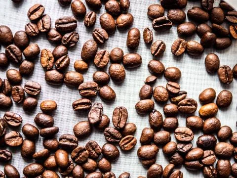 Close-up of coffee beans on a white background Stock Photos