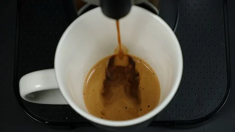 Close up of coffee being brewed in to a cup. Stock Footage 100654698