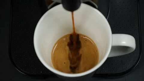Close up of coffee being brewed in to a cup. Stock Footage 100654787