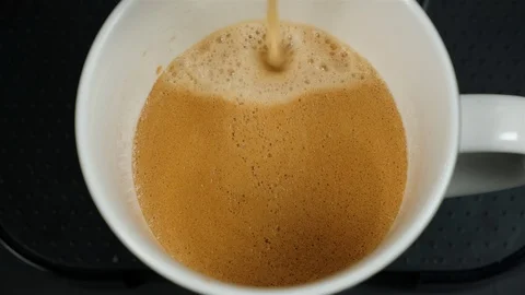 Close up of coffee being brewed in to a cup. Stock Footage 100654994