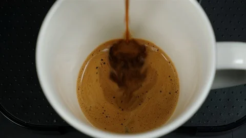 Close up of coffee being brewed in to a cup. Stock Footage 100655328