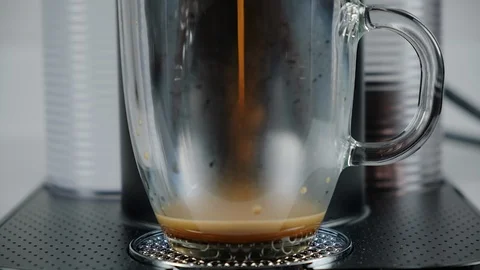 Close up of coffee being brewed in to a cup. Stock Footage 100655588