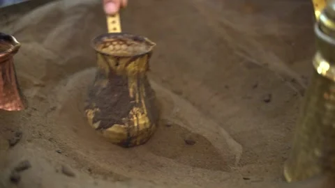Close-up of coffee being heated in the sand Stock Footage 236766652