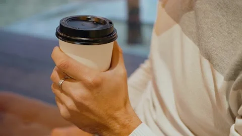 Close-up of a coffee Cup in a man's hand. Stock Footage 139900247